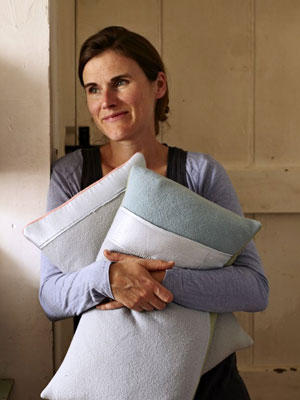 Sarah Moore holding cushions