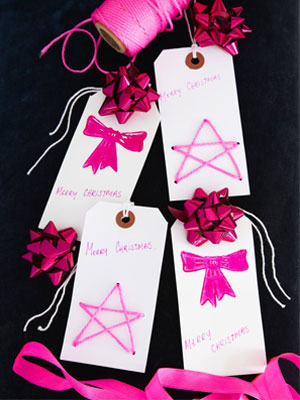 Christmas gift tags with pink shiny bows