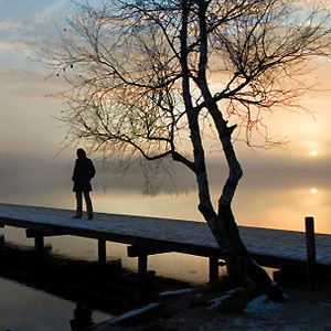 getty - woman on jetty, winter sunset - Do you suffer from Seasonal Affective Disorder? - Your health issues - allaboutyou.com
