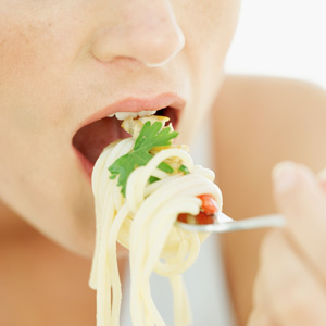 Woman eating pasta - Diet pasta recipes - Diet & wellbeing - allaboutyou.com