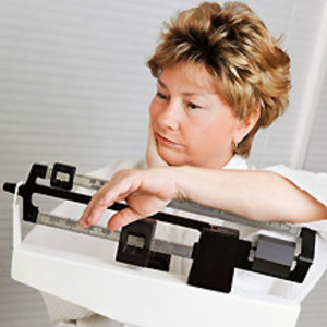 woman disappointed on scales - Find the diet to keep the weight off - diet plan - diet & wellbeing - allaboutyou.com