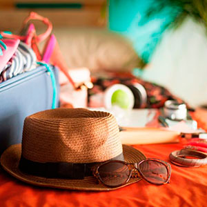 Summer clothes on bed - holiday packing list - summer fashion - allaboutyou.com