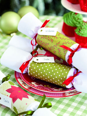 Green personalised Christmas crackers on a dining table - Make personalised Christmas crackers - Craft - allaboutyou.com