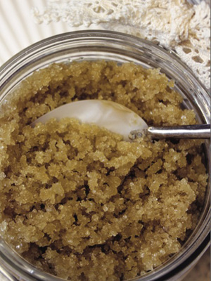 Glass jar with homemade brown sugar body scrub, natural skincare from allaboutyou.com