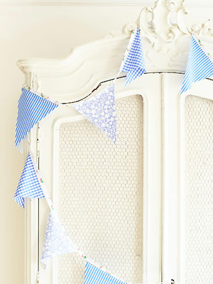 Bunting on white wardrobe - Make bunting from old clothes - Craft - allaboutyou.com
