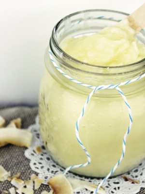 Glass jar filled with homemade coconut body butter, natural skincare from allaboutyou.com