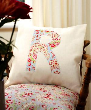 cushion with a capital letter r design