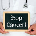 Stop cancer written on blackboard - Ten cancers nobody's talking about - Diet & wellbeing - allaboutyou.com