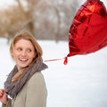 Getty - Woman holding a heart-shaped balloon - How romantic are you? - Diet&wellbeing - allaboutyou.com