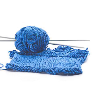 blue knitting, yarn and needles