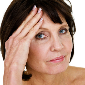 Mature woman hand on head - All about...the perimenopause - Diet&wellbeing - allaboutyou.com