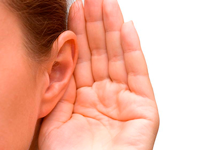 Woman listening hand on ear - Ten health issues you can tackle today - Diet & wellbeing - allaboutyou.com
