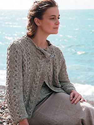 Woman wearing cable knit wrap jacket free knitting patterns allaboutyou.com