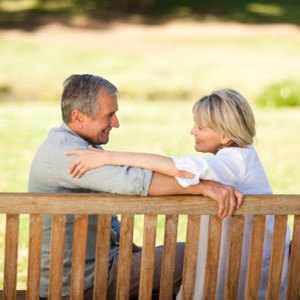 Happy couple sitting on a bench - make your marriage work - Diet & wellbeing - allaboutyou.com