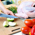 123 woman cutting apple by turkey - Avoid Christmas food poisoning - Diet & wellbeing - allaboutyou.com