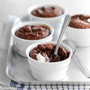 Chocolate pudding oozing with a spoon in the pot