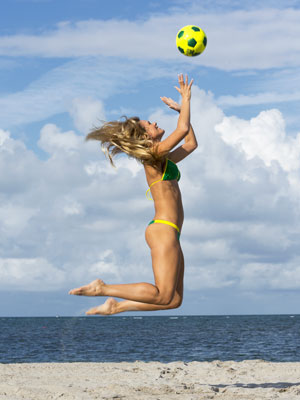 Woman in bikini with football - How to score a Brazilian beach body - Diet&wellbeing - allaboutyou.com